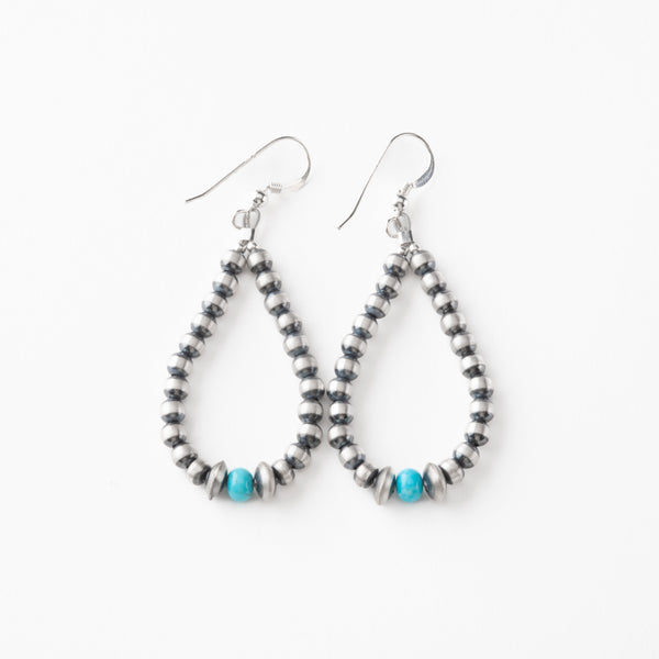 Pair of beaded earrings with turquoise beads on a white background