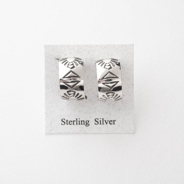 Pair of sterling silver earrings on a display card with 'Sterling Silver' text.