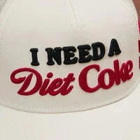 White cap with 'I Need a Diet Coke' text on a white background