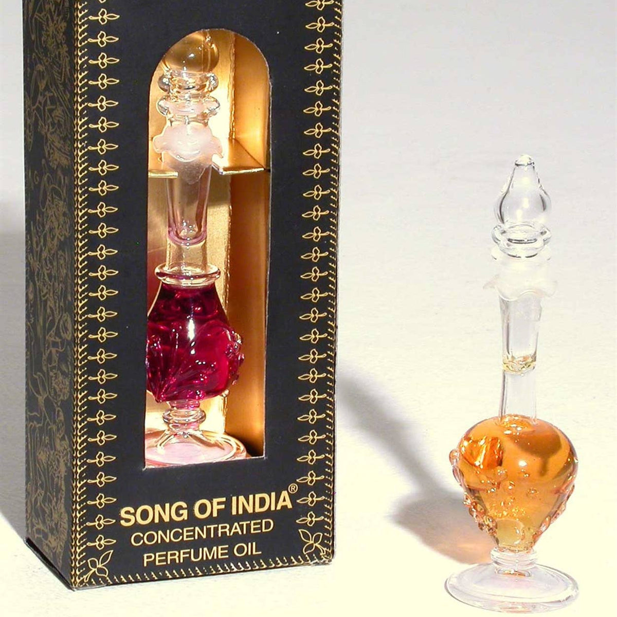 Perfume oil bottle with decorative packaging labeled 'Song of India' on a light gray background.