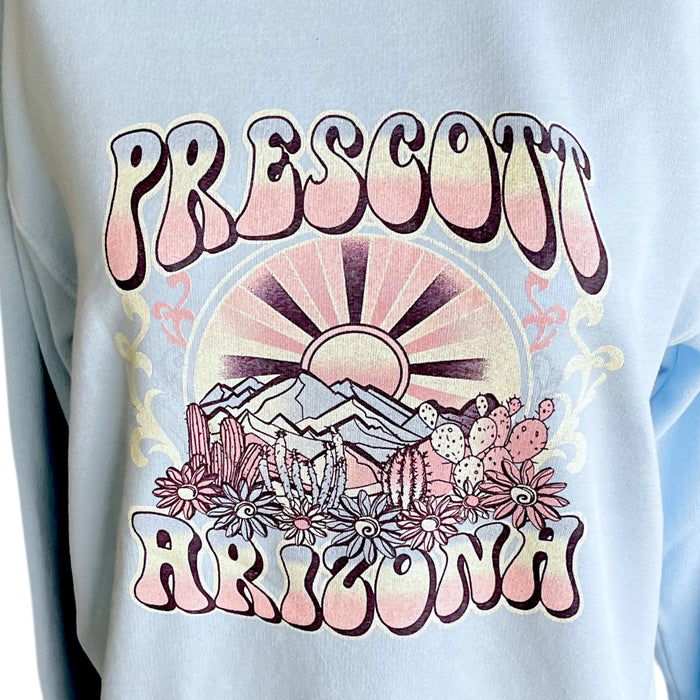 Light blue sweatshirt with 'Prescott Arizona' graphic design featuring mountains and cacti.