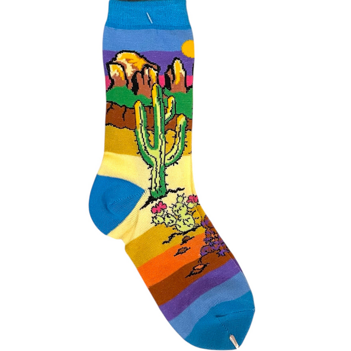 Colorful sock with desert landscape design on a white background