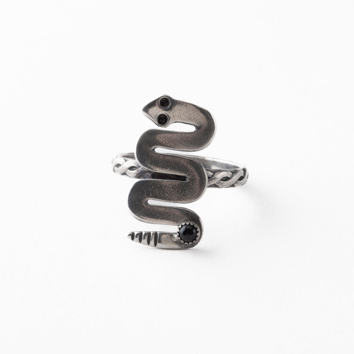 Silver snake-shaped ring on a white background