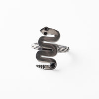 Silver snake-shaped ring on a white background