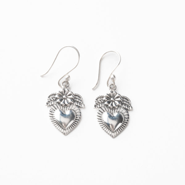 Silver heart-shaped earrings on a white background