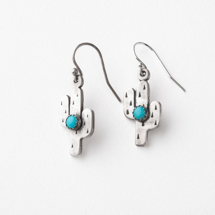 Silver cactus-shaped earrings with turquoise stones on a white background