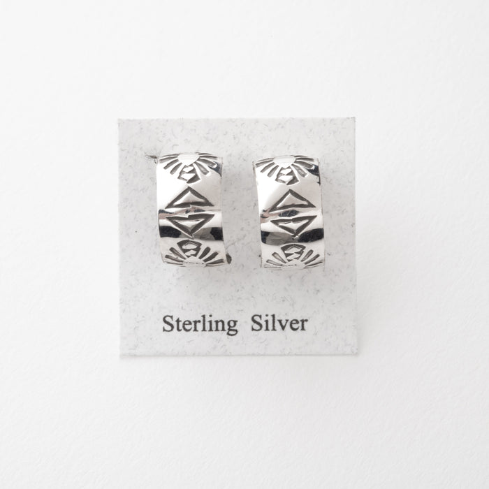 Pair of sterling silver earrings on a display card with 'Sterling Silver' text.