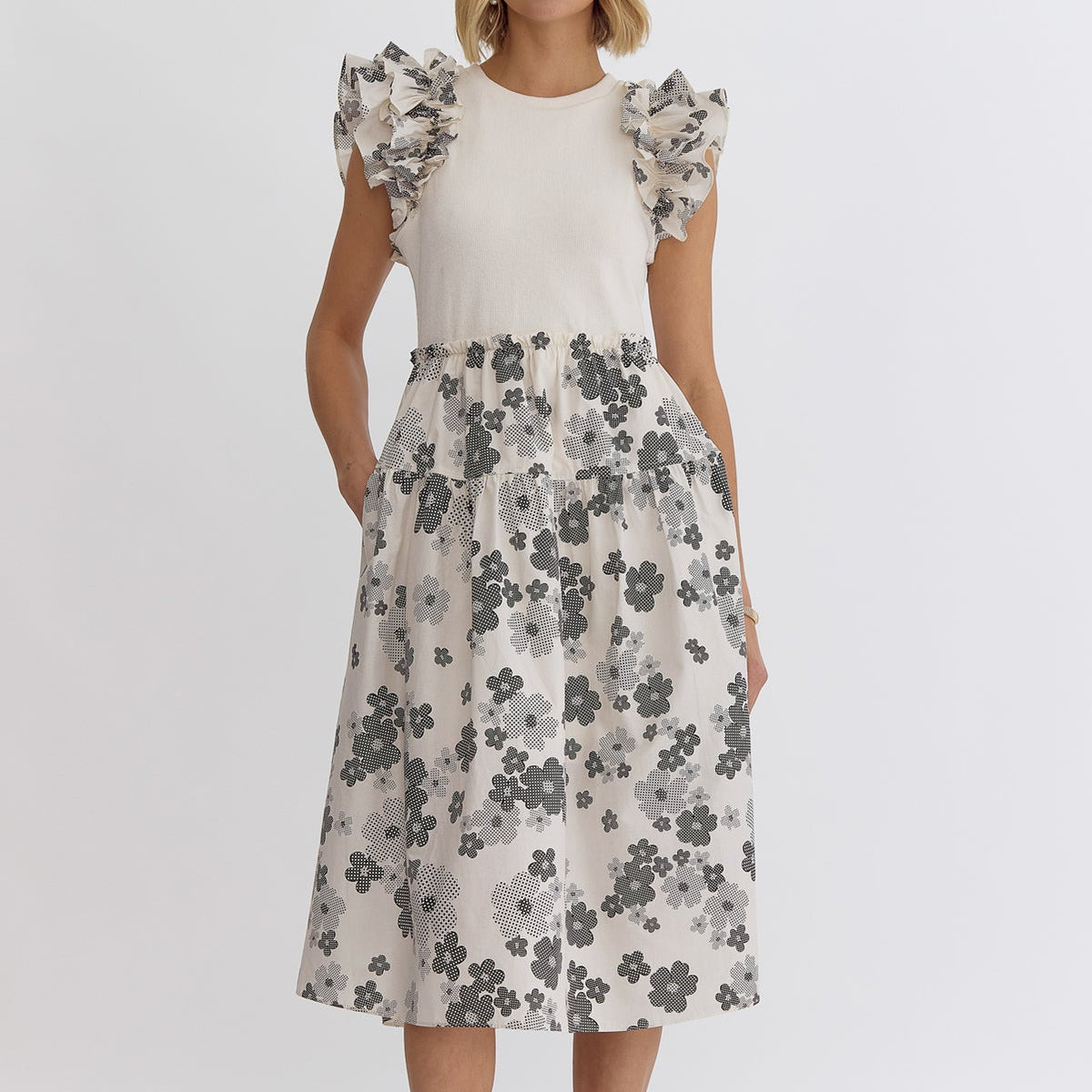 Cream: Floral print round neck ruffle sleeve midi dress featuring solid top. Pocket at sides. Lined. Woven. Non-sheer. Lightweight.