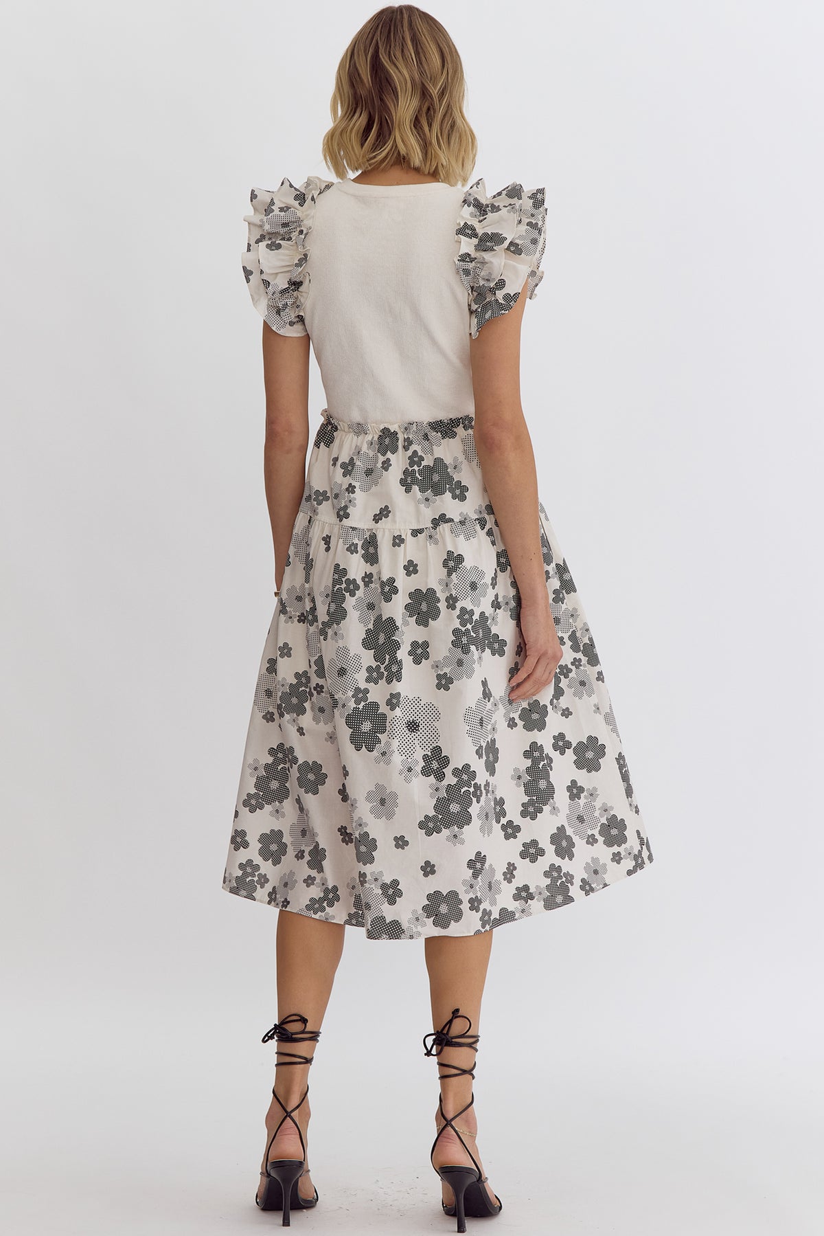 Cream: Floral print round neck ruffle sleeve midi dress featuring solid top. Pocket at sides. Lined. Woven. Non-sheer. Lightweight.