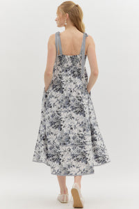Black:Floral print high empire midi dress featuring contrast bow tie strap. Smocked back panel. Pockets at side. Lined. Woven. Non-sheer. Lightweight.