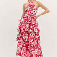 Red: Paisley print tiered bow tie halter midi dress featuring contrast accented binding finish. Lined. Woven. Non-sheer. Lightweight.