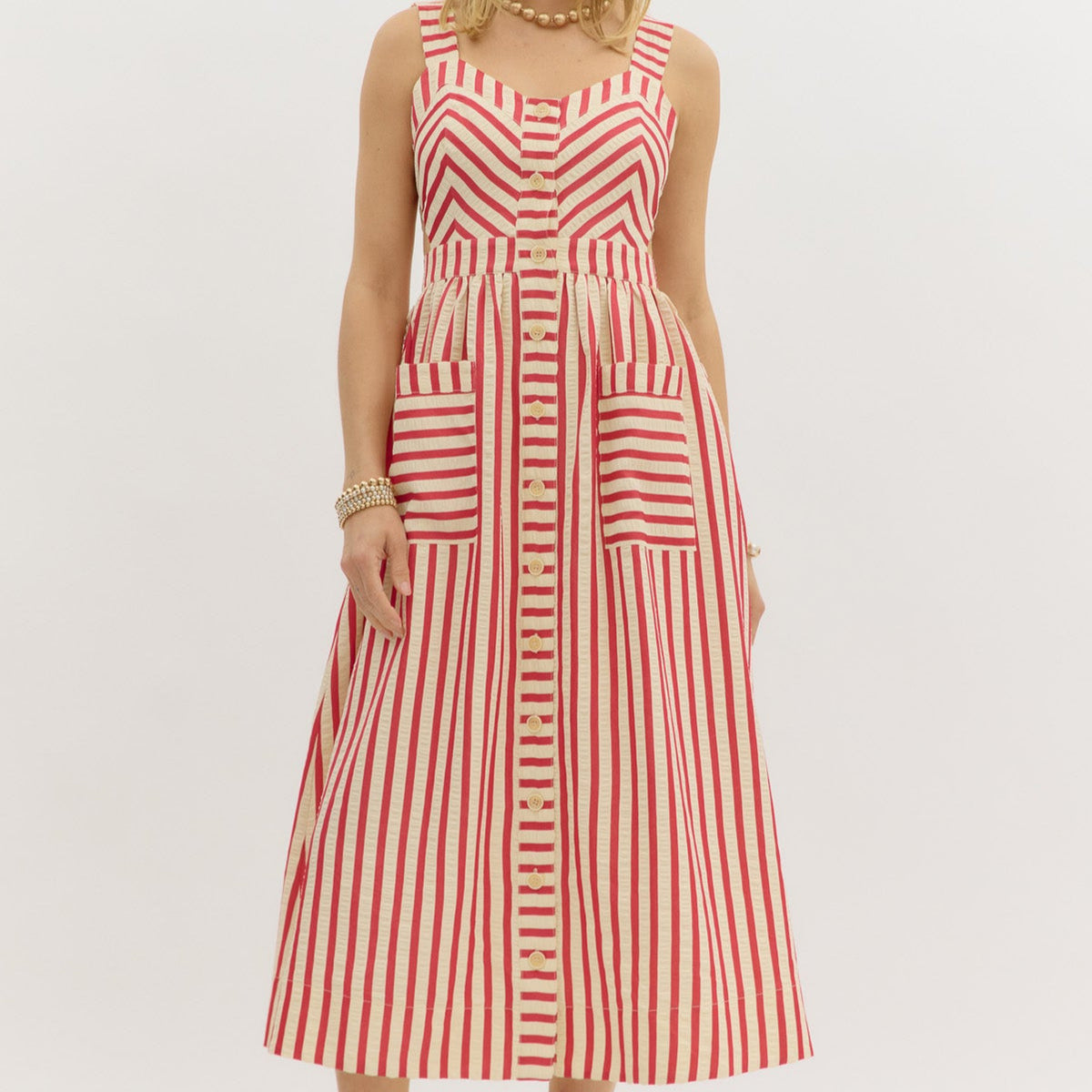 Red: Stripe pattern sweetheart neckline strap shoulder dress featuring cutout details at side. Pockets at front. Front button closure with elasticated waistband at back. Lined. Woven. Non-sheer. Lightweight.