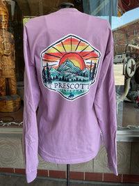 Purple long-sleeve shirt with a Prescott, Arizona graphic on the back, displayed in front of a store window.