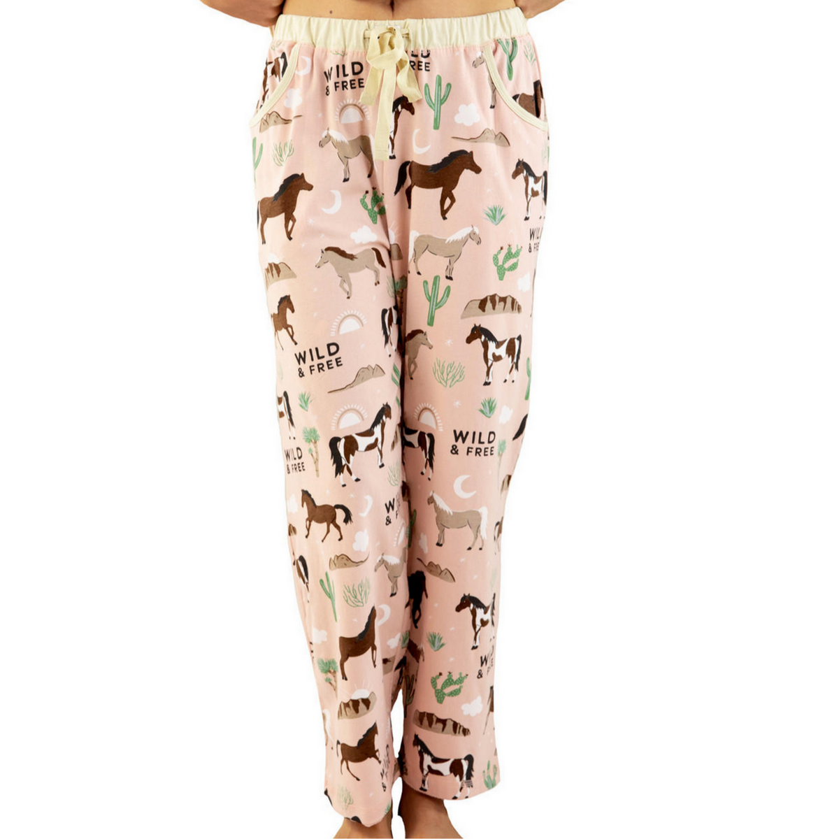 Pajama pants with horse and cactus pattern on a pink background