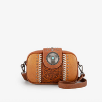 Brown leather crossbody bag with decorative elements on a white background