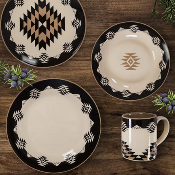 Black, white, and tan aztec pattern dish set on wood background.