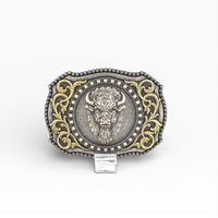 Decorative belt buckle with bull emblem and gold accents on a white background