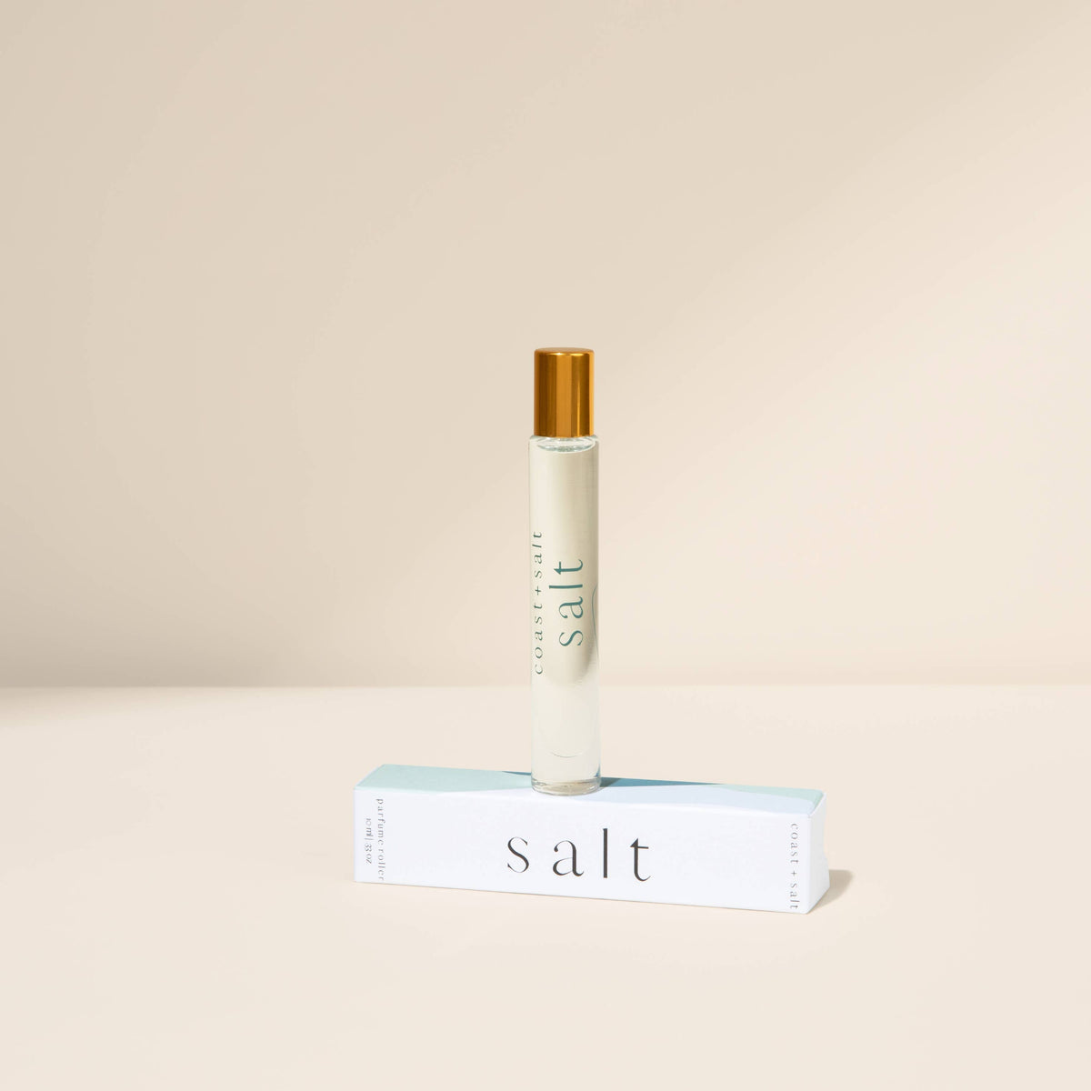 Roll-on bottle labeled 'salt' on a beige background