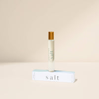 Roll-on bottle labeled 'salt' on a beige background